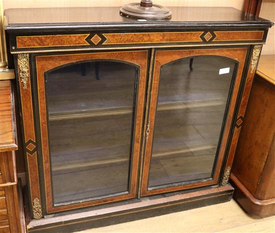 A Victorian ebonised and amboyna dwarf bookcase W.110cm